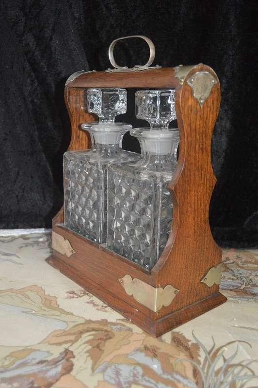 Beautiful 2 bottle oak  tantalus with original key