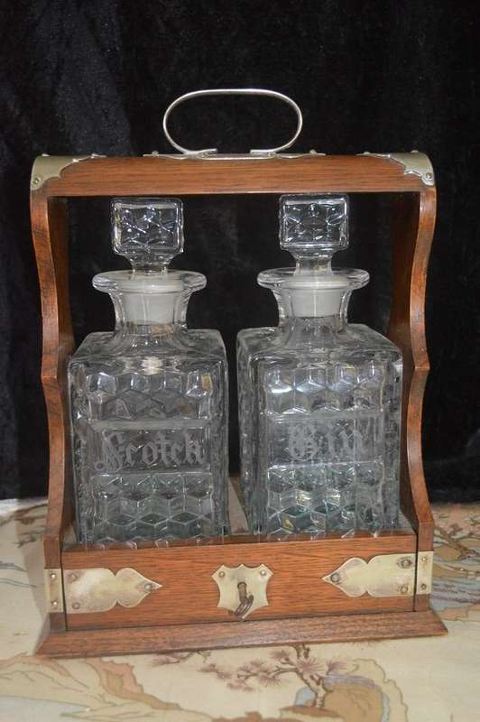 Beautiful 2 bottle oak  tantalus with original key