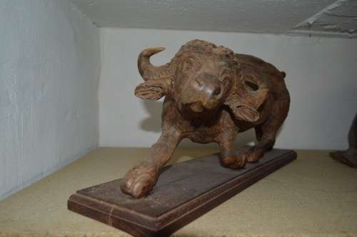 Very large from the 80's ironwood carved buffalo of rosewood base