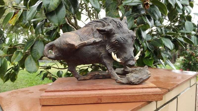 Very large from the 80's ironwood carved buffalo of rosewood base
