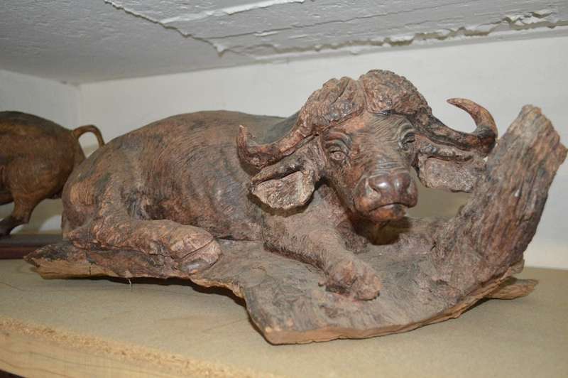 Very large from the 80's ironwood carved buffalo of rosewood base