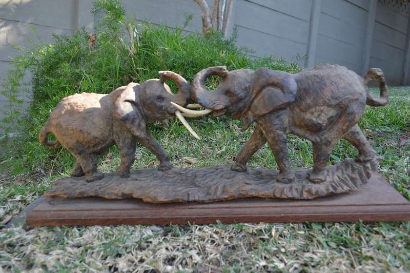 Very large from the 80's ironwood carved buffalo of rosewood base