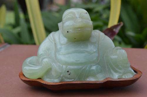 Chinese jade stone laughing buddha on wood base