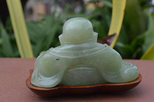 Chinese jade stone laughing buddha on wood base