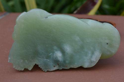 Chinese jade stone laughing buddha on wood base