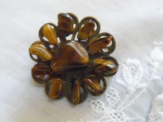 TYGERS EYE BROOCH IN GOLD TONED CASING WITH SILVER TONED BACK PIN