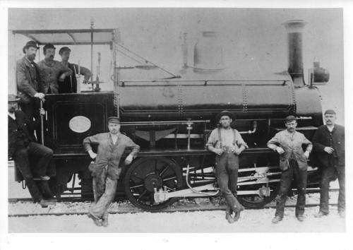 Photograph  of an old rail photo  Rail worker posing