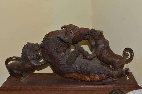 STUNNING, DETAILED BUFFALLO ATTACH BY LION PAIR. IRON WOOD