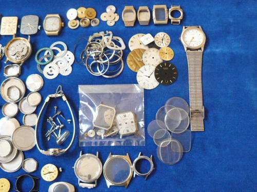 ASSORTED WATCH SPARES , MOVEMENTS AND LOADS OF EXTRAS