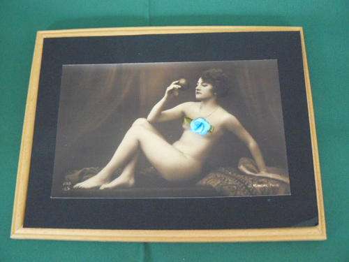 FRAMED PHOTO OF LADY WITH APPLE