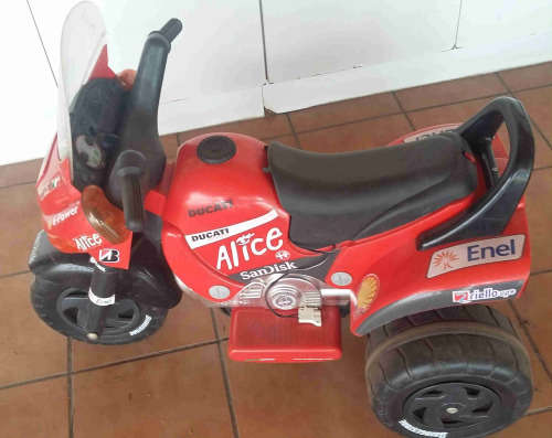 Childs ride on battery powered tricycle.