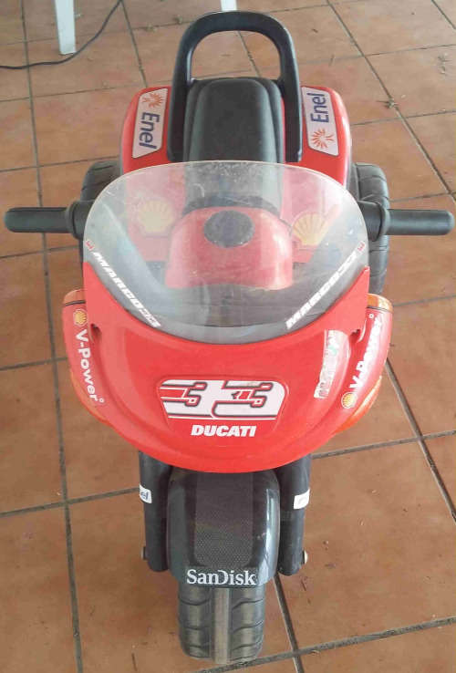 Childs ride on battery powered tricycle.