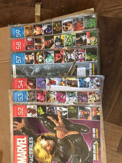 68 x Marvel Fact files and 1 folder as per pictures-All Sealed in plastic