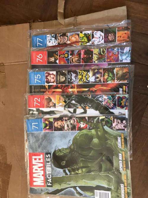 68 x Marvel Fact files and 1 folder as per pictures-All Sealed in plastic