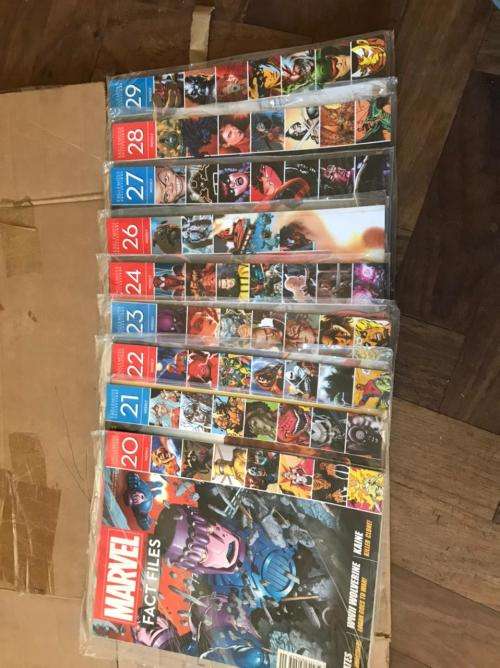 68 x Marvel Fact files and 1 folder as per pictures-All Sealed in plastic