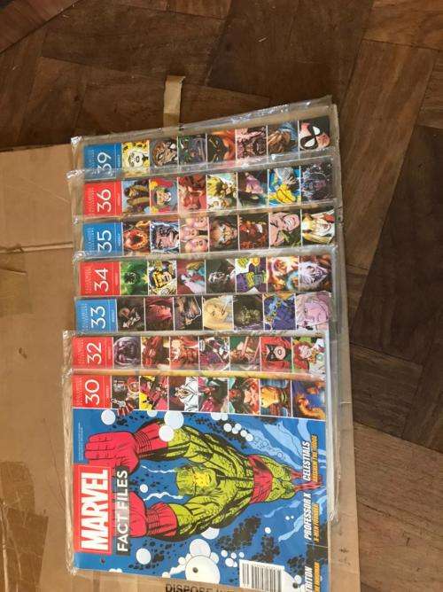 68 x Marvel Fact files and 1 folder as per pictures-All Sealed in plastic