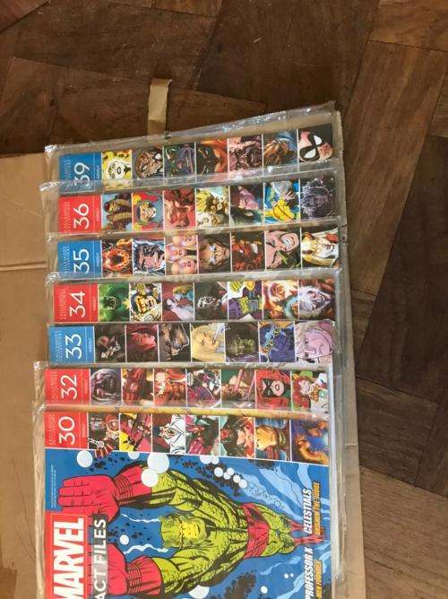 68 x Marvel Fact files and 1 folder as per pictures-All Sealed in plastic