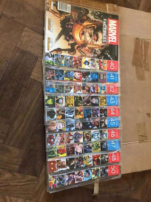 68 x Marvel Fact files and 1 folder as per pictures-All Sealed in plastic