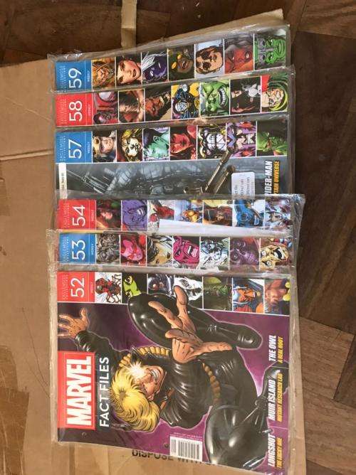 68 x Marvel Fact files and 1 folder as per pictures-All Sealed in plastic