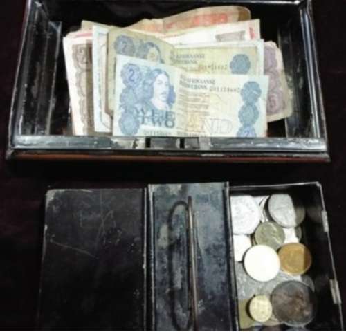 WOW.Huge hoard of coins and notes and some silver in vintage money box.
