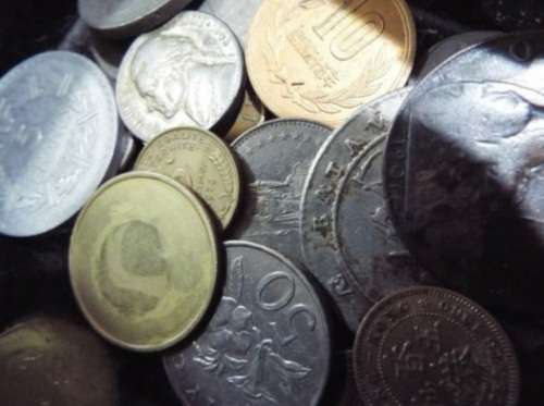 WOW.Huge hoard of coins and notes and some silver in vintage money box.