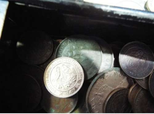 WOW.Huge hoard of coins and notes and some silver in vintage money box.
