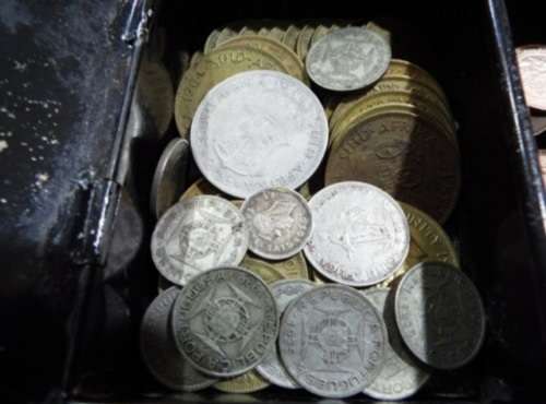WOW.Huge hoard of coins and notes and some silver in vintage money box.