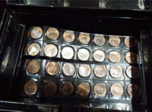 WOW.Huge hoard of coins and notes and some silver in vintage money box.