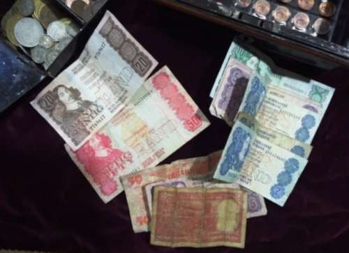 WOW.Huge hoard of coins and notes and some silver in vintage money box.