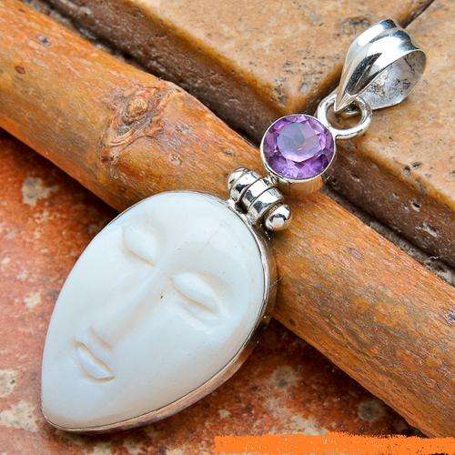 Exquisite Solid Silver Carved Bone Face pendant...