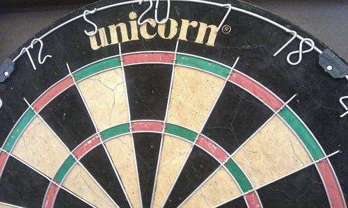 unicorn dart board with cabinet and darts