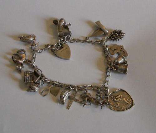 SILVER CHARM BRACELET WITH 17 BEAUTIFUL CHARMS