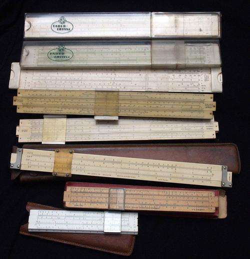 A Collection of 8 Vintage Slide Rules - one more than a 100 years old