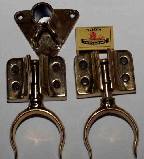 A pair of solid brass rowlocks and flag mount