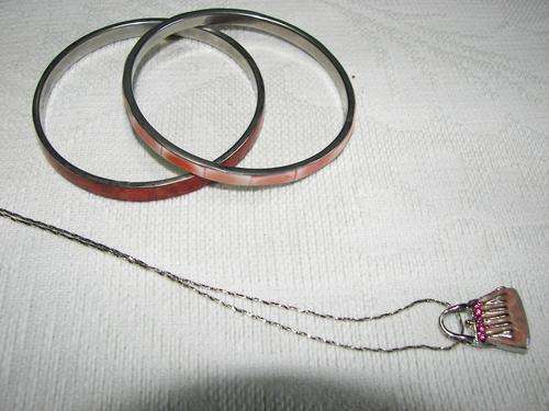 2 Bracelets(?mother of pearl) 1 suitcase pendent on silver coloured chain