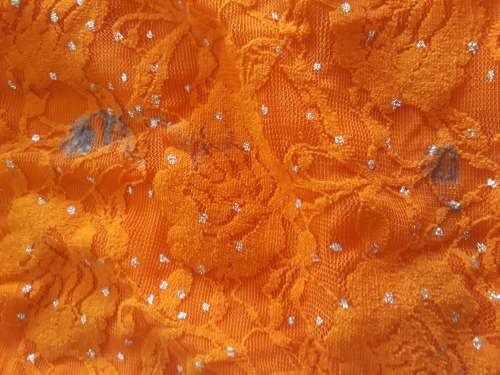 LADIES ORANGE TOP WITH A FEW MARKS ON IT