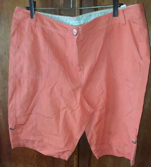 LADIES: ORANGE SHORTS - MAKE: WOOLWORTHS  - SIZE: 18