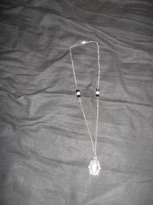 Black cameo and nickel necklace