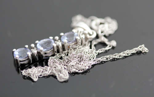 VINTAGE TANZANITE AND DIAMOND DELICATE PENDANT NECKLACE IN 10K WHITE GOLD. GEOMETRIC CUBE DESIGN.
