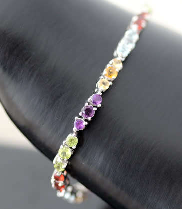 COLOURFUL AMETHYST, GARNET, TOPAZ AND PERIDOT STERLING SILVER TENNIS BRACELET. SOLID 925