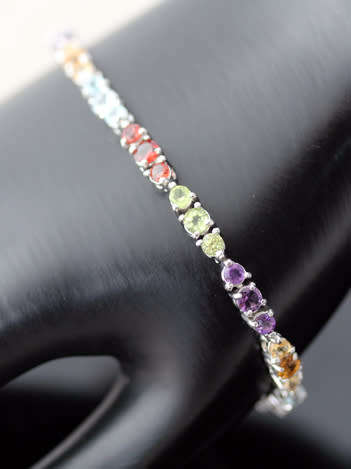 COLOURFUL AMETHYST, GARNET, TOPAZ AND PERIDOT STERLING SILVER TENNIS BRACELET. SOLID 925