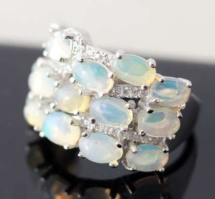 BROAD BAND STERLING SILVER RING SET WITH AAA QUALITY RAINBOW WHITE OPALS.