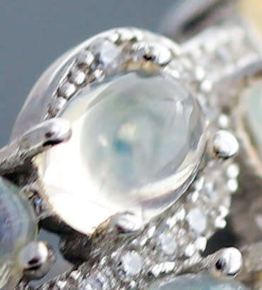BROAD BAND STERLING SILVER RING SET WITH AAA QUALITY RAINBOW WHITE OPALS.