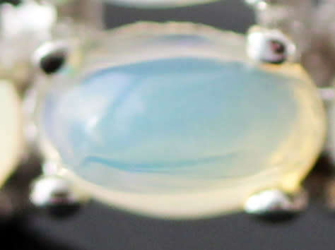BROAD BAND STERLING SILVER RING SET WITH AAA QUALITY RAINBOW WHITE OPALS.