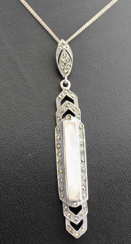 LONG ART DECO MOTHER OF PEARL AND MARCASITE STERLING SILVER PENDANT ON A SIMPLE 39CM CHAIN. 925