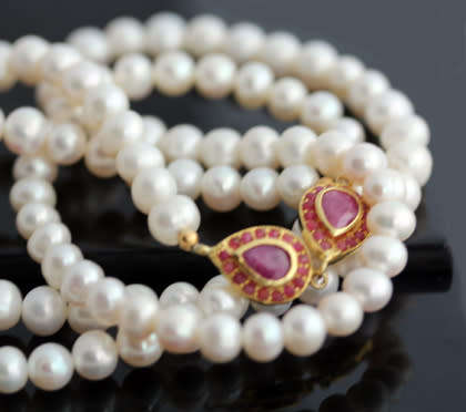 VERY LONG 83cm PEARL NECKLACE WITH ELEGANT FEATURE NATURAL RUBIES IN GOLD-HUED STERLING SILVER