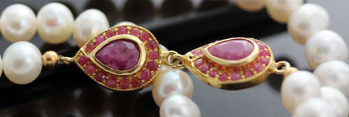 VERY LONG 83cm PEARL NECKLACE WITH ELEGANT FEATURE NATURAL RUBIES IN GOLD-HUED STERLING SILVER