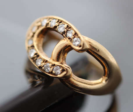 DAINTY VINTAGE 9CT YELLOW GOLD AND NATURAL DIAMOND HORSESHOE RING. 375. VERY SMALL SIZE