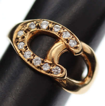 DAINTY VINTAGE 9CT YELLOW GOLD AND NATURAL DIAMOND HORSESHOE RING. 375. VERY SMALL SIZE