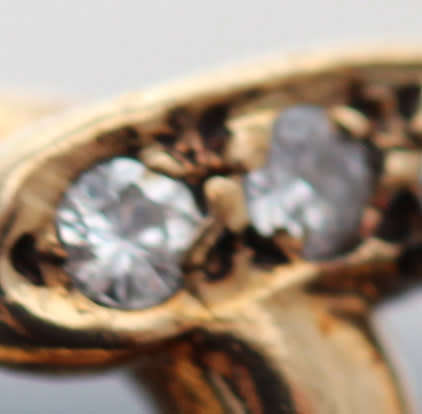 DAINTY VINTAGE 9CT YELLOW GOLD AND NATURAL DIAMOND HORSESHOE RING. 375. VERY SMALL SIZE